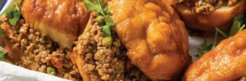 Delicious golden vetkoek freshly fried and ready to serve