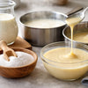 Stages of condensed milk production with industrial equipment and stainless steel tanks