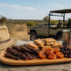 Safari Treats platter of dried meat, orange fruit and rusks on a wooden board, with a metal mug nearby