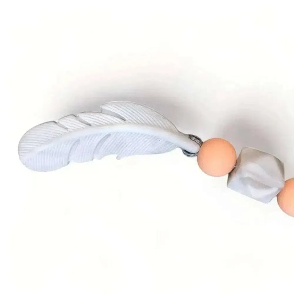 Natural wooden baby teething ring with silicone beads, safe and BPA-free, handmade in South Africa.