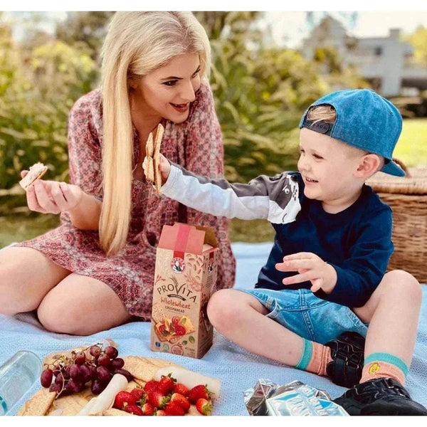 Bakers Provita biscuits - Wholewheat Crispbread 500g with picnic setting and family.