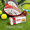 Bakers Tennis Biscuits 200g on grass with tennis equipment.