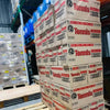 Stacks of Bakers Tennis Classic Coconut Rusks boxes in a warehouse setting.
