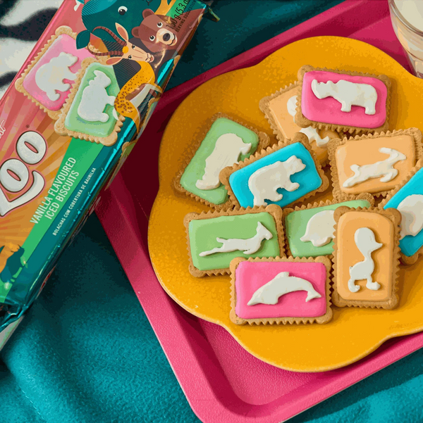 Bakers Zoo Biscuits 150g with colorful iced animal shapes displayed on a tray.
