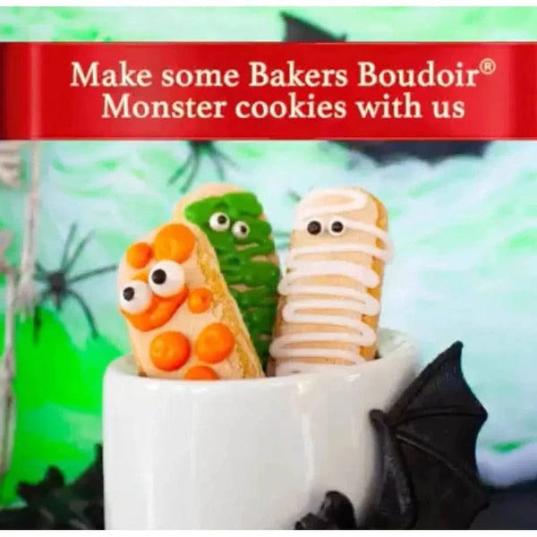 Bakers Boudoir Original Finger Biscuits decorated as colorful monster cookies in a white cup.