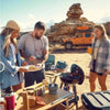 Outdoor cooking scene with friends around a CADAC Carri Chef 40 gas BBQ in a rugged landscape.