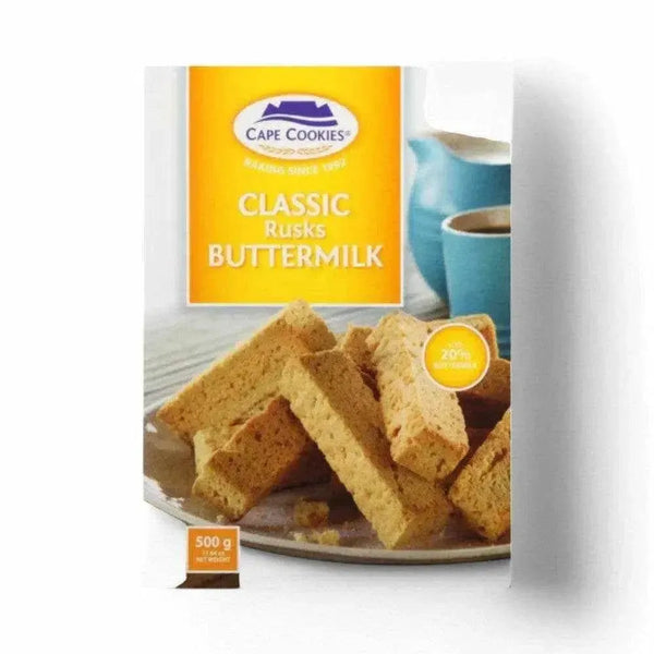 Cape Cookies Buttermilk Rusks 500g package with crispy golden rusks and coffee cup in background.