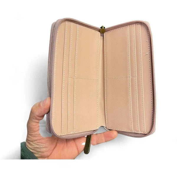 Open pink Cotton Road large PU leather wallet showing multiple card slots and zip compartments.