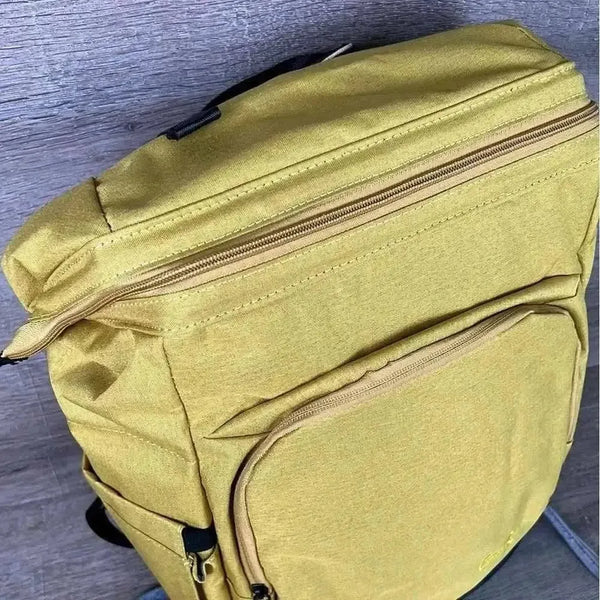 Mustard Cotton Road Nappy Bag backpack with front zip, side bottle pockets, changing mat, and wet bag