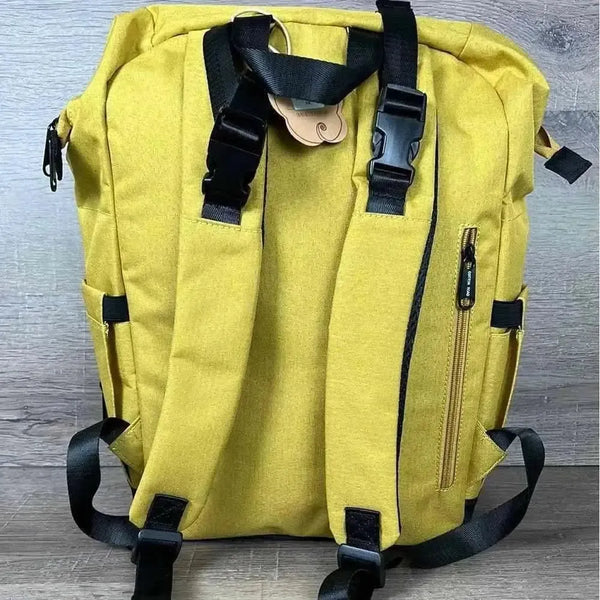 Cotton Road Nappy Bag mustard backpack with front zip, side bottle pockets, changing mat, and wet bag