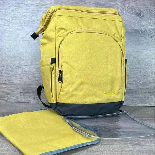 Cotton Road Nappy Bag mustard backpack with front zip, side pockets, changing mat, and wet bag