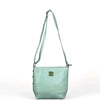Cotton Road Sling Bag in green PU leather with weave effect and adjustable strap