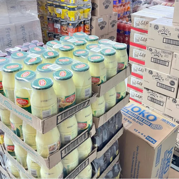 Multiple jars of Crosse & Blackwell Tangy Mayonnaise 750g stacked in a store display