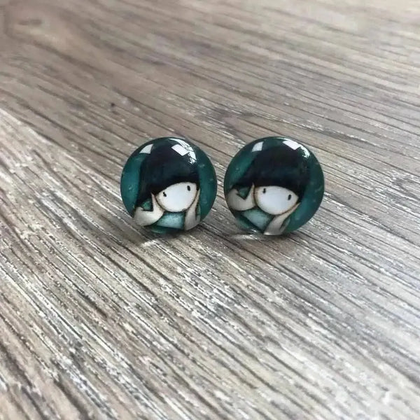 Various Girl Doll earrings in 15mm diameter pairs displayed