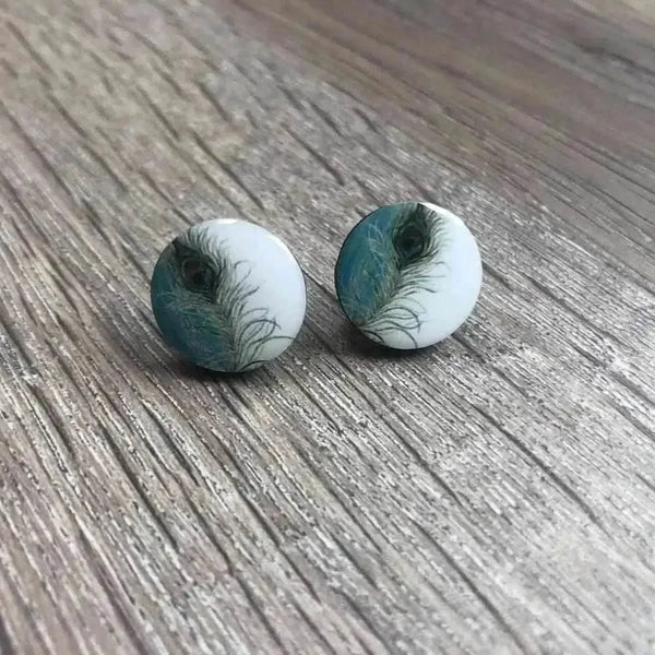 White earrings with peacock feather design, 15mm diameter, sold in pairs