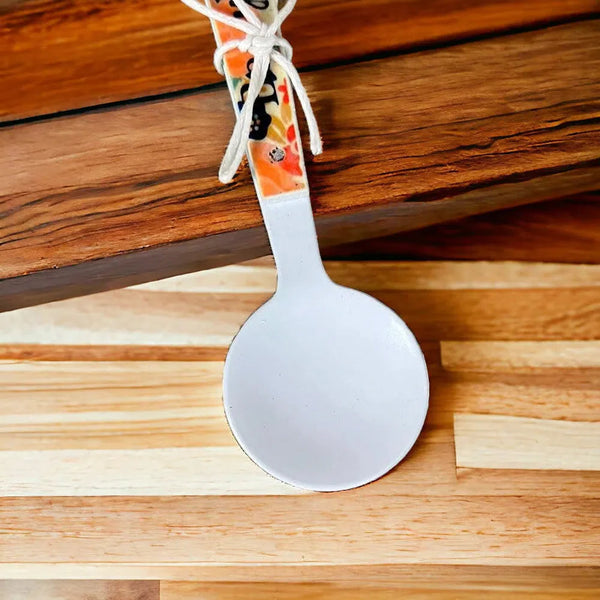Enamel printed sugar spoon with decorative wooden handle and "Be You Tiful" design