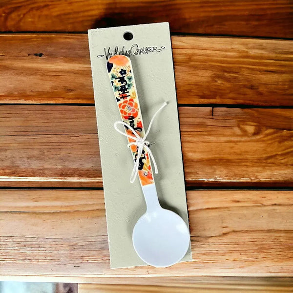 Enamel printed sugar spoon with floral design and wooden painted handle