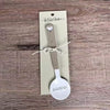 Enamel sugar spoon with wooden handle and laser engraved birds on a wire design