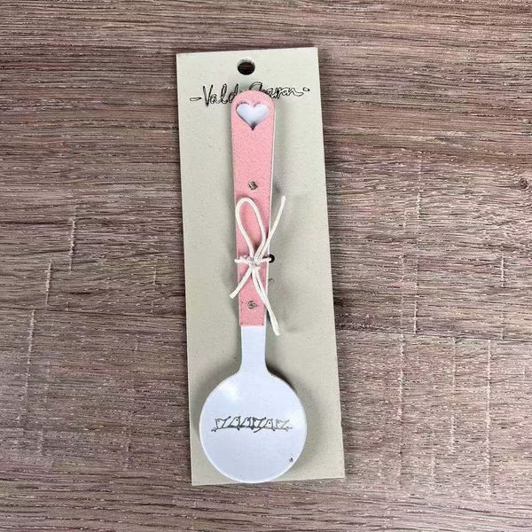 Enamel sugar spoon with wooden handle and laser engraved birds on a wire design