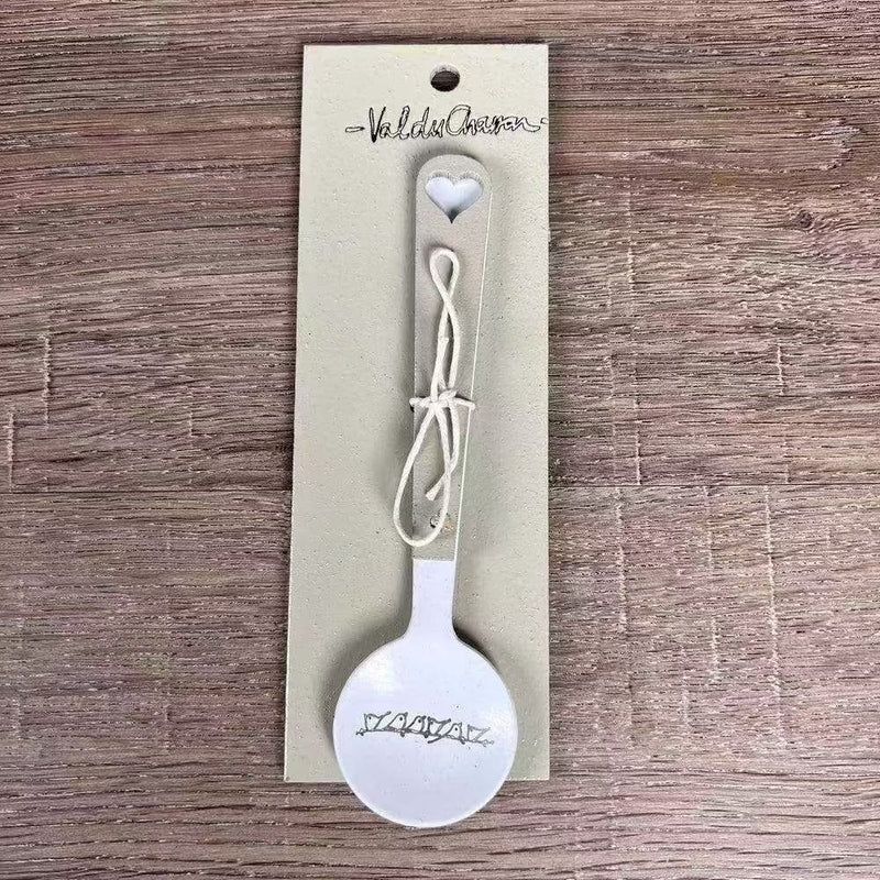 Enamel sugar spoon with wooden handle and laser engraved birds on a wire design