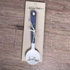 Enamel sugar spoon with wooden handle and farmhouse flower engraving
