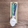 Enamel teaspoon set with wooden handles and birds on a wire design laser engraved on the spoons