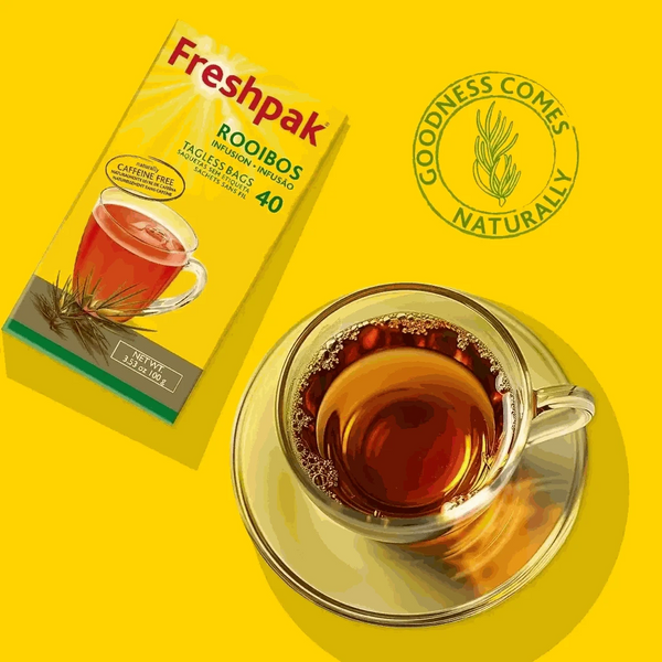 Freshpak Rooibos Tea 80's box with a cup of brewed rooibos tea on a yellow background, highlighting natural goodness and caffeine-free attributes