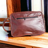 Dark genuine leather Woesmooi laptop bag with adjustable shoulder strap for laptops up to 15.6 inches