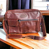Dark genuine leather Woesmooi laptop bag with adjustable shoulder strap for laptops up to 15.6 inches