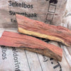 Camel Thorn firewood pieces on Kameeldoring bag for efficient home heating.