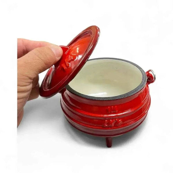 Traditional 3-Legged Cast Iron Pot, 0.7L, red enamel finish with lid, ideal for outdoor cooking and potjie dishes.