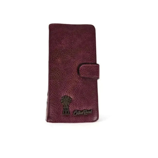 Large maroon wallet with bronze metal windmill, zip compartment, cardholders, and clip closure in PU leather
