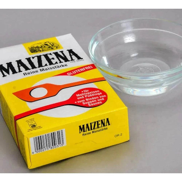 Maizena Corn Flour 500g pack with glass bowl, gluten-free corn starch for versatile cooking and baking.