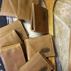 Light brown genuine leather mens wallet with card slots and note section, folded design