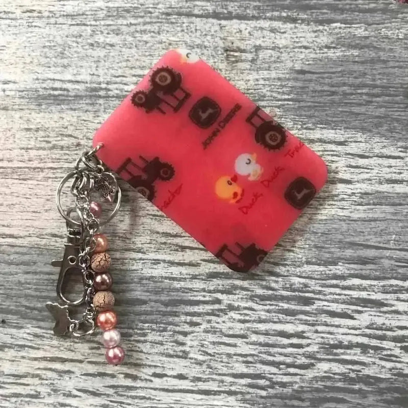 Pink John Deere keyring 65mm x 45mm