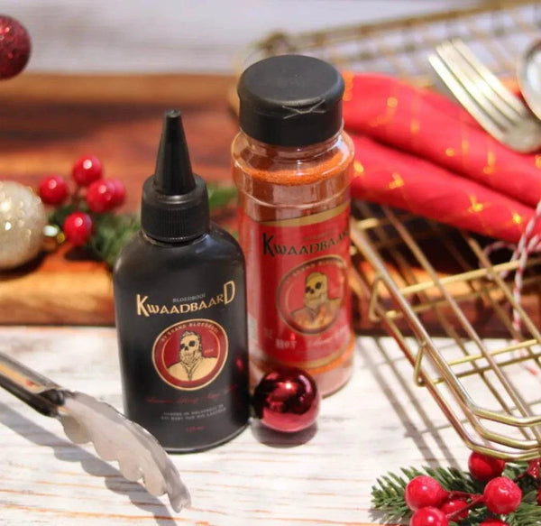 Rooibaard Kwaadbaard Sauce 125ml with festive decorations.