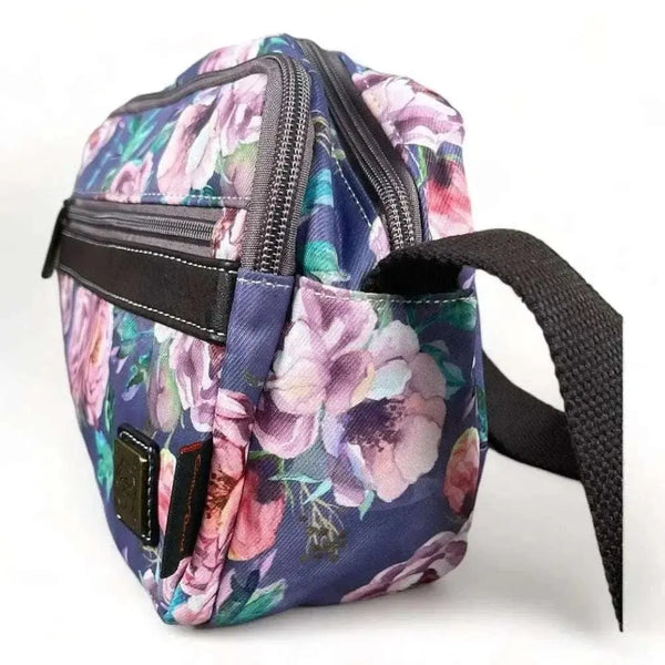 Canvas sling bag with purple flowers and multiple zip compartments