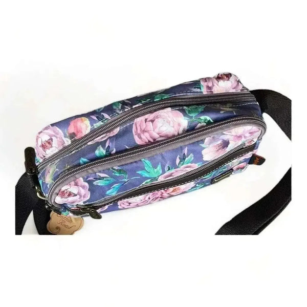 Canvas sling bag with purple flowers and multiple zip compartments