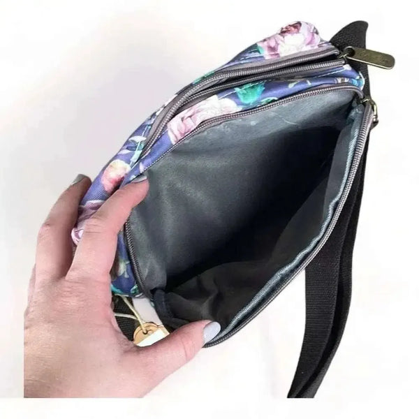 Canvas sling bag with purple flowers and adjustable shoulder strap