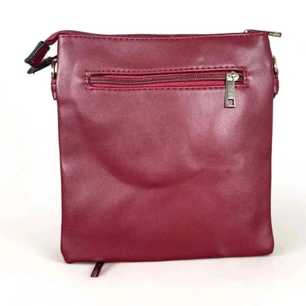 Maroon PU leather sling bag with adjustable strap and lattice detailing