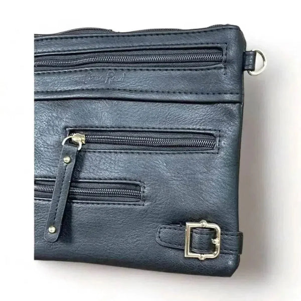 Black PU leather sling bag with adjustable strap and multiple zip compartments