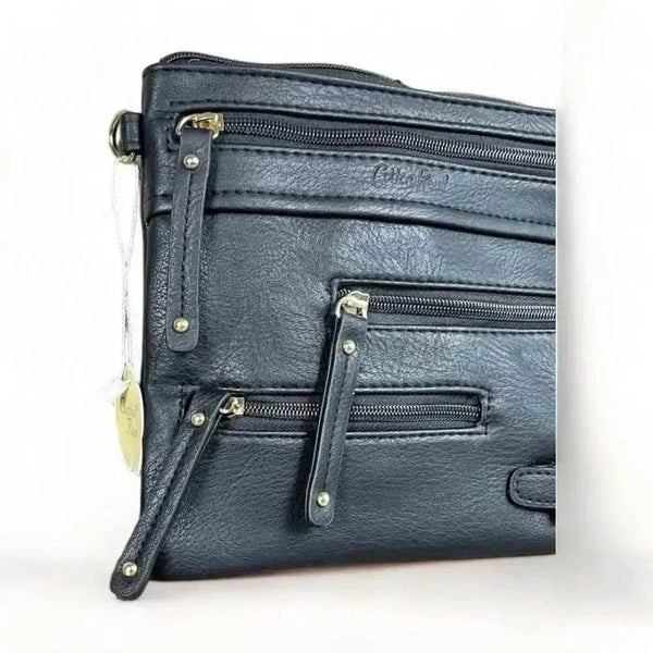 Black PU leather sling bag with adjustable strap and multiple zip compartments