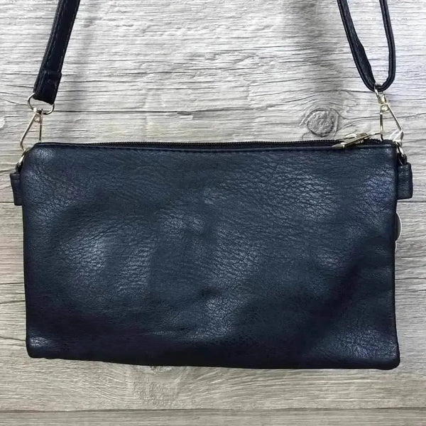 Navy PU leather sling bag with adjustable strap and multiple zip compartments
