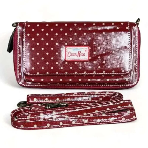 Red sling wallet with small dots and removable shoulder strap
