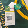 Close-up of green and gold Springbok Official Licensed Supporter T-Shirt tag with SA Rugby logo and Pick n Pay partnership label
