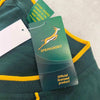 Springbok Official Licensed Supporter T-Shirt tag on green cotton fabric with yellow trim