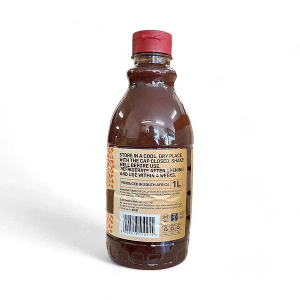 SPUR BBQ Sauce 1L bottle - tangy and smoky flavor, perfect for braais, bastings, and marinades.
