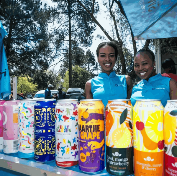 Switch Energy Drink Jelly Babies display at outdoor event with brand ambassadors.