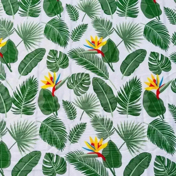 White tablecloth with Delicious Monster and Strelitzia floral print on dining table