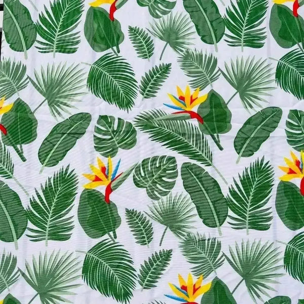 White tablecloth with Delicious Monster and Strelitzia flower print on dining table